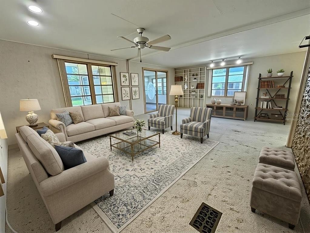 A dining area features carpeted floors, built-in cabinetry, a stained-glass pendant light, and wallpaper — 416 PALO VERDE DRIVE, LEESBURG, FL