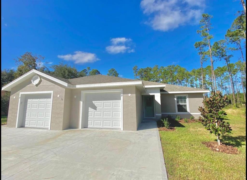This floor plan shows two mirrored residential units, each featuring three bedrooms, a garage, and lanai — 74 EMERSON DRIVE UNIT A & B, PALM COAST, FL