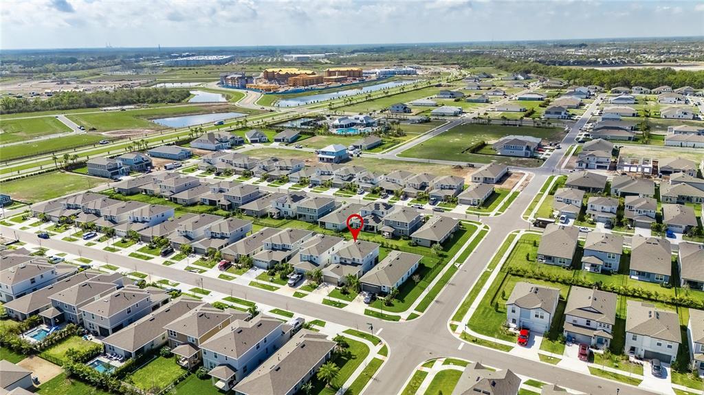Aerial view of a suburban neighborhood with a red pin marking a specific house — 6255 GOLDEN BEACH DRIVE, APOLLO BEACH, FL
