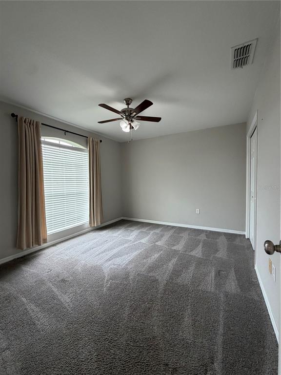 A bathroom features a vanity, a built-in soaking tub, and a glass-enclosed shower — 5619 FISCHER DRIVE, LAKELAND, FL