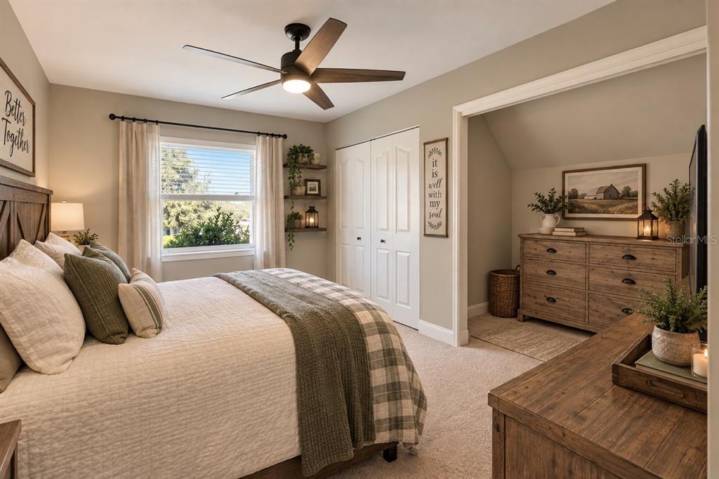 A kitchen with light tile floors, oak cabinets, a tiled island, and a large hutch — 16131 JOHNS LAKE ROAD, CLERMONT, FL