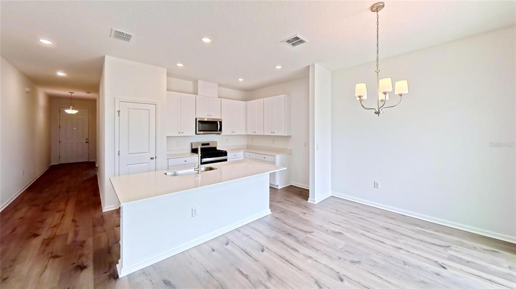This is a floor plan for a four-bedroom home with a two-car garage and patio — 6213 SANDERS GROVE CIRCLE, LEESBURG, FL