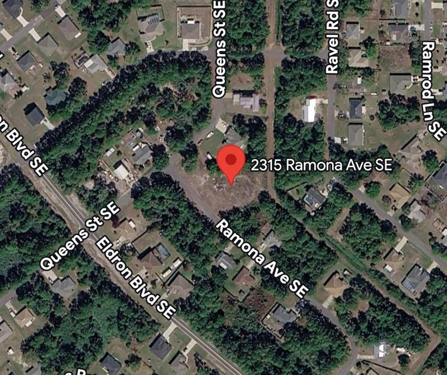 This is a satellite map view showing a vacant residential lot marked with a red pin — 2315 RAMONA AVENUE SE, PALM BAY, FL