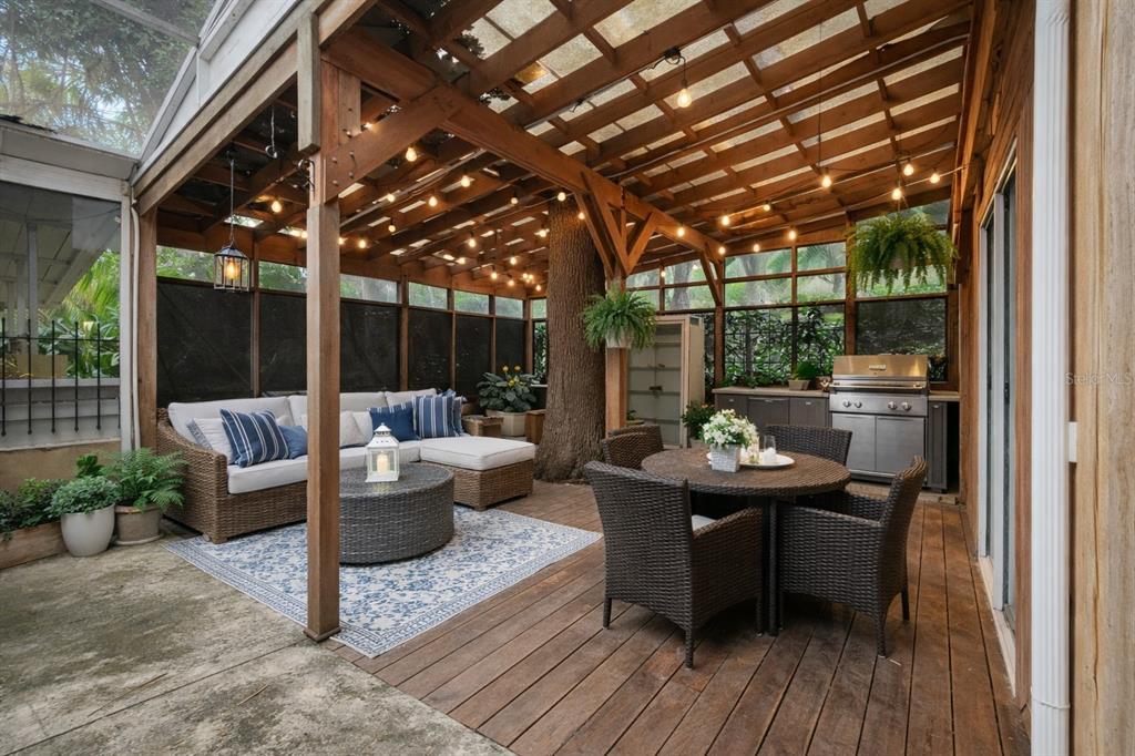 A screened-in patio features a brick floor, a small pool, and a wooden bar — 286 SHAMROCK DRIVE, VENICE, FL