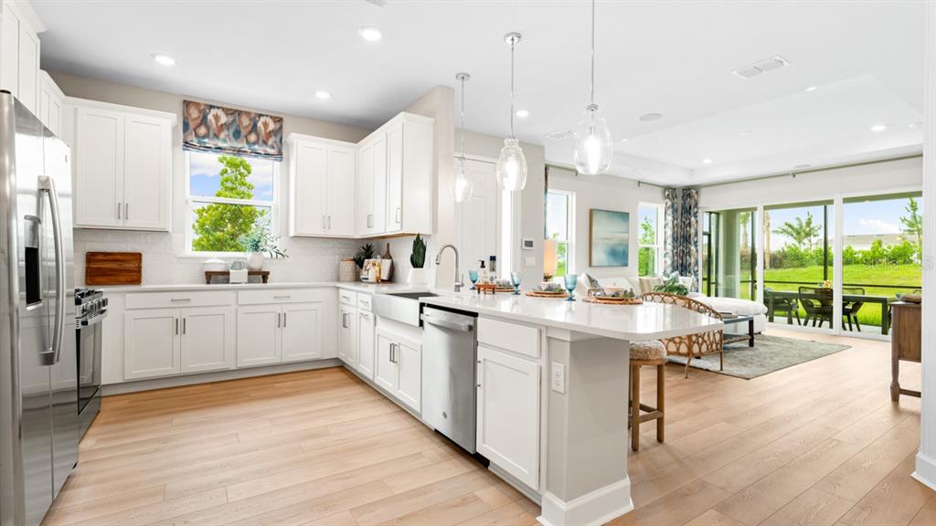 This floor plan shows a single-story home with a two-car garage, lanai, and three bedrooms — 13340 SANTINI CIRCLE, ENGLEWOOD, FL