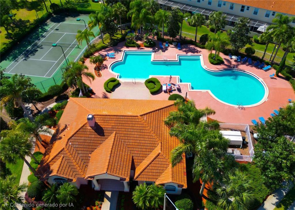 An aerial view of a community clubhouse with a swimming pool and a tennis court — 4812 CORAL CASTLE DRIVE, KISSIMMEE, FL
