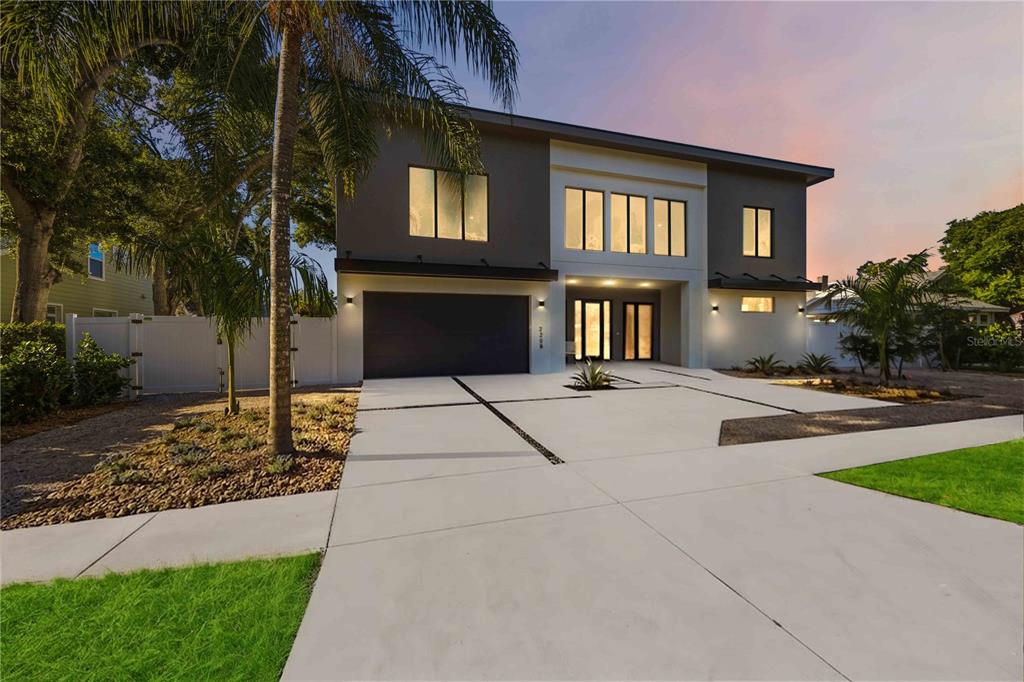 An aerial view shows a modern two-story house with a flat roof and an unfinished pool — 2258 ARLINGTON STREET, SARASOTA, FL