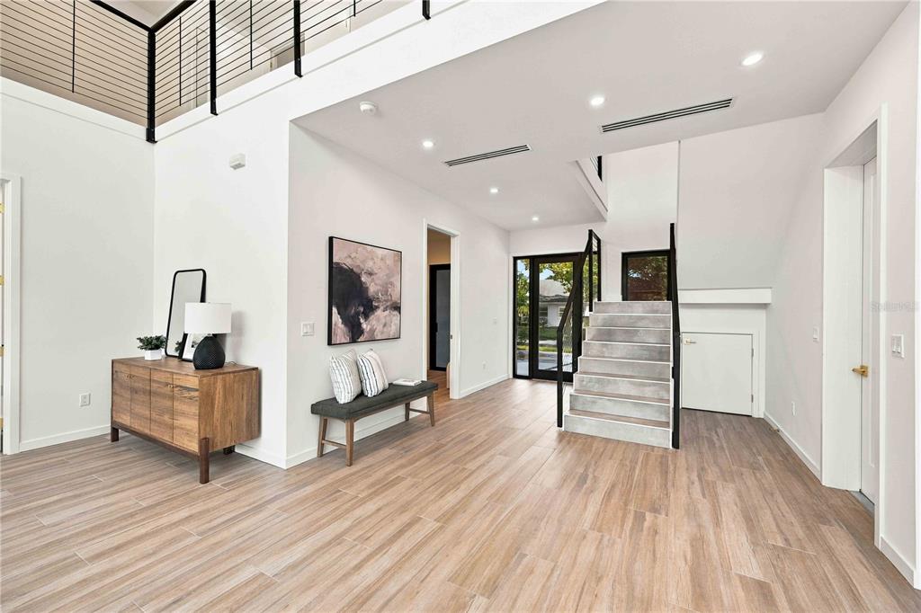 An aerial view shows a flat-roofed house with an unfinished pool area and dirt yard — 2258 ARLINGTON STREET, SARASOTA, FL