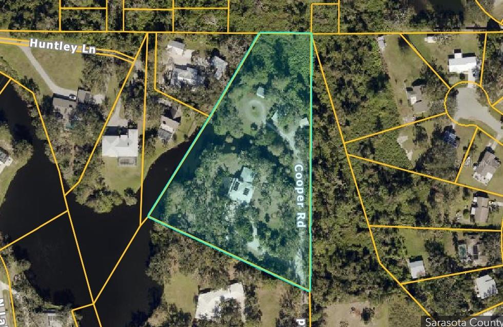 An aerial map view shows a property outlined in teal, situated along Cooper Road — 4554 COOPER ROAD, SARASOTA, FL