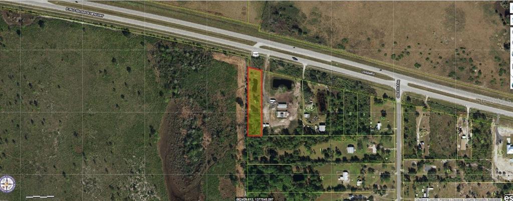 An aerial map view shows a rectangular plot of land highlighted in red near a highway — 11300 E IRLO BRONSON MEMORIAL HIGHWAY, ST CLOUD, FL