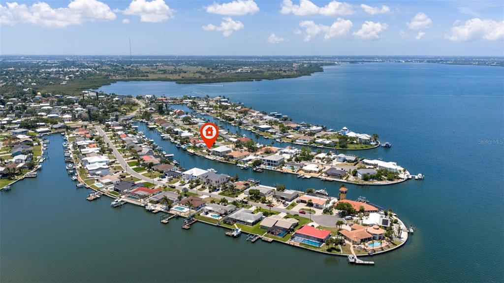 An aerial view shows a single-story house with a brown roof and a concrete driveway — 5108 COMMONWEALTH ROAD, PALMETTO, FL