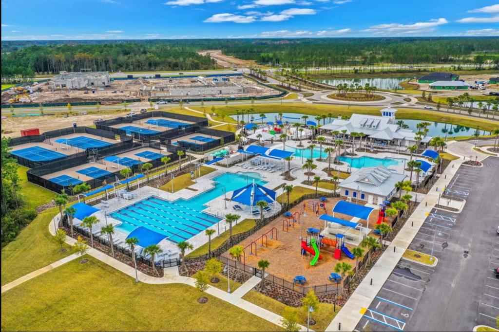 An aerial view of a community recreation center featuring swimming pools, tennis courts, and playgrounds — 333 BROOK FOREST DRIVE, ST AUGUSTINE, FL