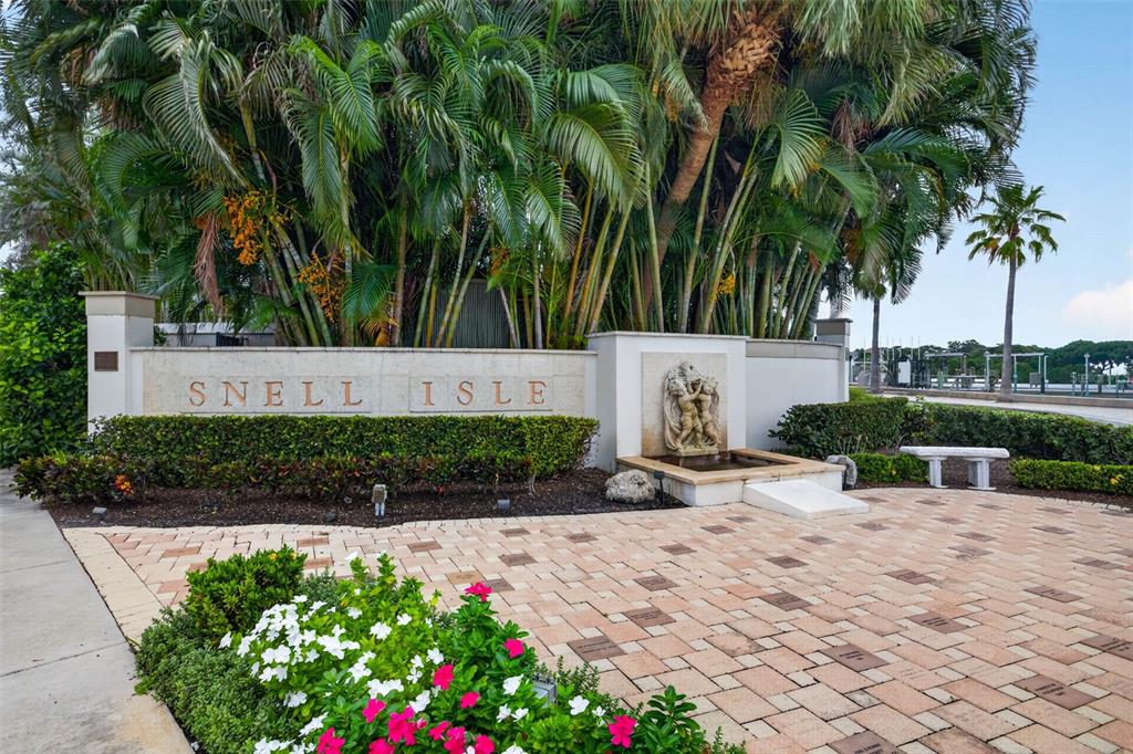 A stone monument sign for Snell Isle stands before lush palm trees and a small fountain — 201 SNELL ISLE BOULEVARD NE, ST PETERSBURG, FL
