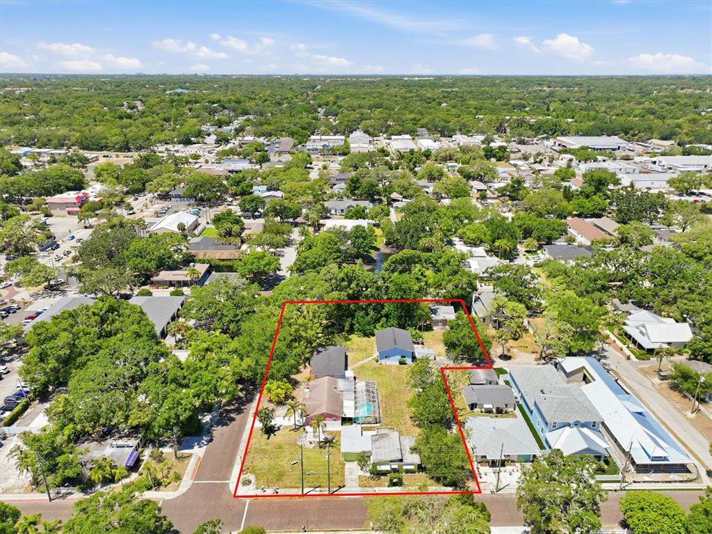 An aerial view shows a residential lot with multiple buildings and a pool outlined in red — 515 2ND STREET N, SAFETY HARBOR, FL
