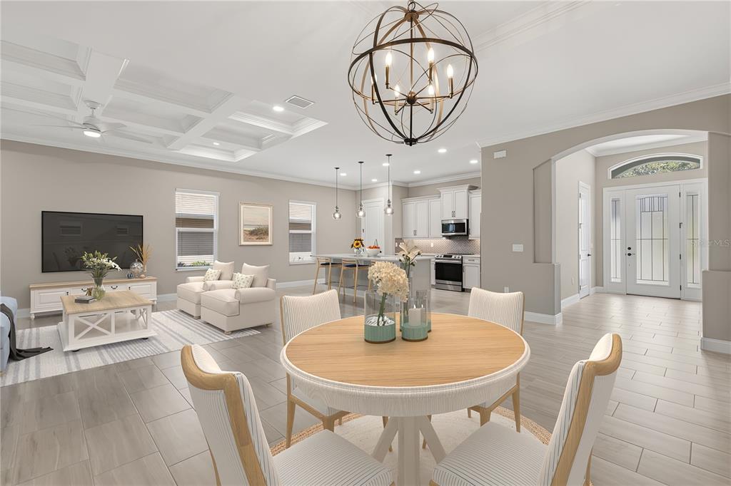 An open-concept living area features a kitchen, dining space, and living room with tile floors — 7 OASIS CIRCLE, PALM COAST, FL