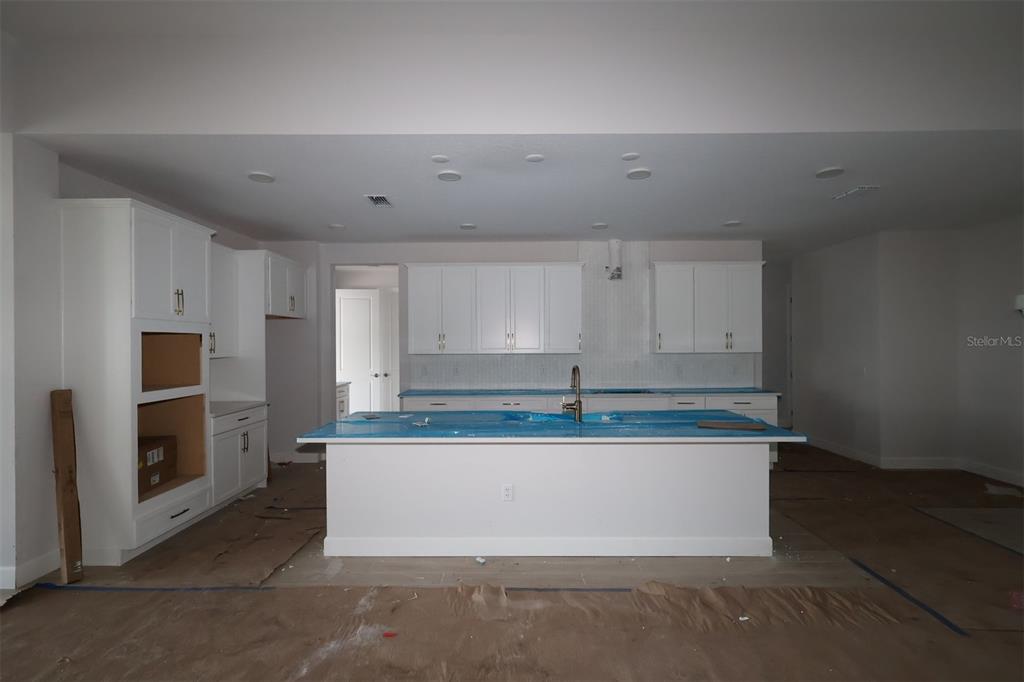 Interior view of a house under construction featuring exposed wood framing and concrete block walls — 3011 SOLACE WAY, ORLANDO, FL