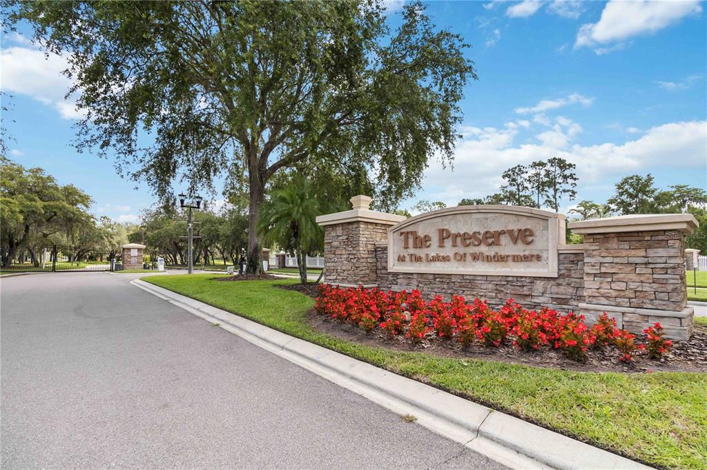 A stone entrance sign for The Preserve at The Lakes of Windermere stands outdoors — 13519 BICTON LANE, WINDERMERE, FL