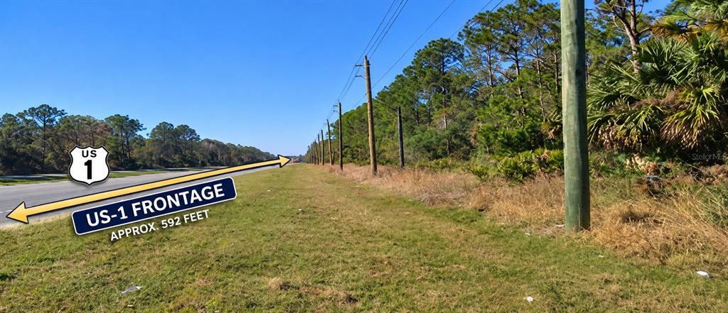 An aerial view shows a 9.94-acre wooded lot with US-1 road frontage — US 1 NORTH, BUNNELL, FL