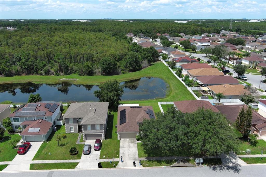 A single-story house with a beige exterior, a two-car garage, and a front lawn — 11545 BENTRY STREET, ORLANDO, FL