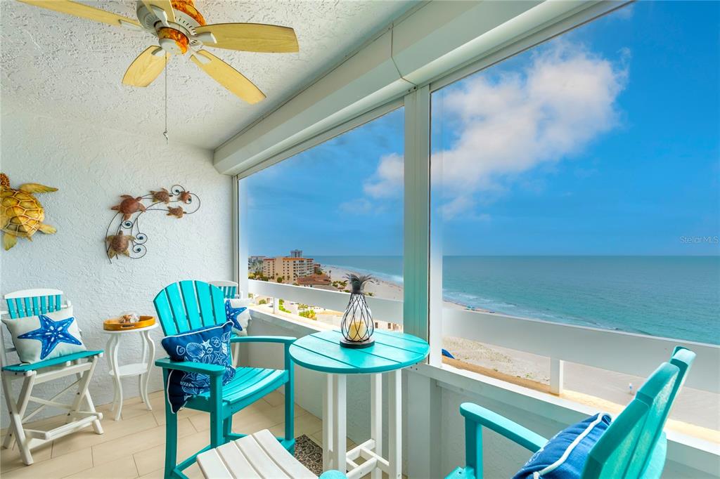 An aerial view shows three tall beachfront apartment buildings with a red arrow pointing toward one — 17900 GULF BOULEVARD UNIT 11C, REDINGTON SHORES, FL