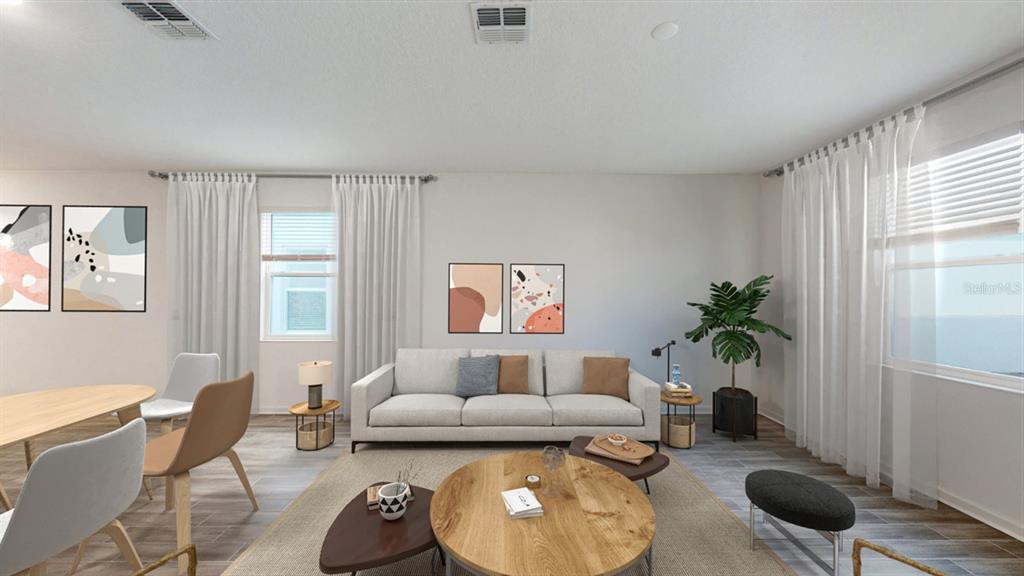 This is a digital rendering of a living room featuring a sofa, coffee table, and dining area — 5654 KETTLEBELL ALLEY, CLERMONT, FL
