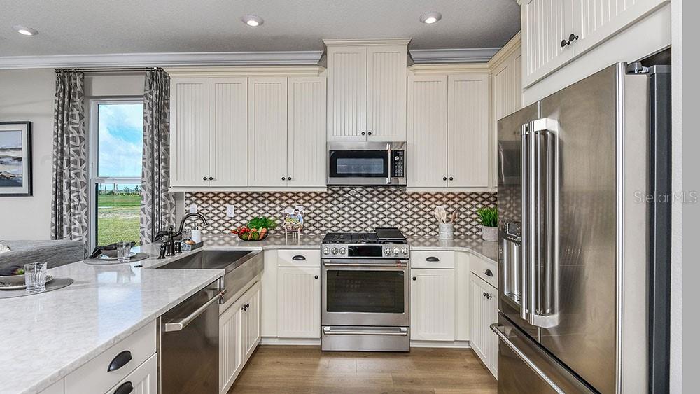 This is a floor plan of a home's first level featuring a garage and lanai — 10836 ECLIPSE STREET, SARASOTA, FL