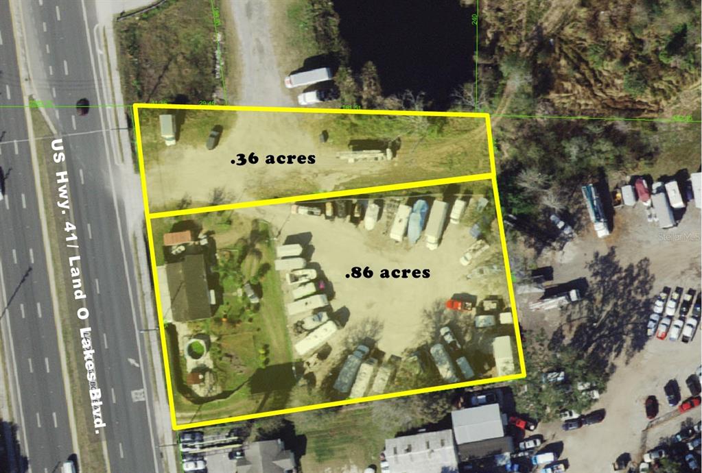 This aerial map shows two adjacent land parcels totaling 1.22 acres along a highway — 6012 LAND O LAKES BOULEVARD, LAND O LAKES, FL