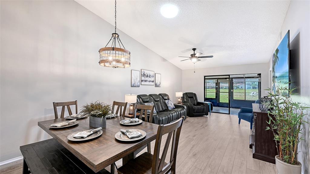 An aerial view shows a single-story residential building with a central courtyard and parking area — 6129 HERITAGE LANE W UNIT 6129, BRADENTON, FL