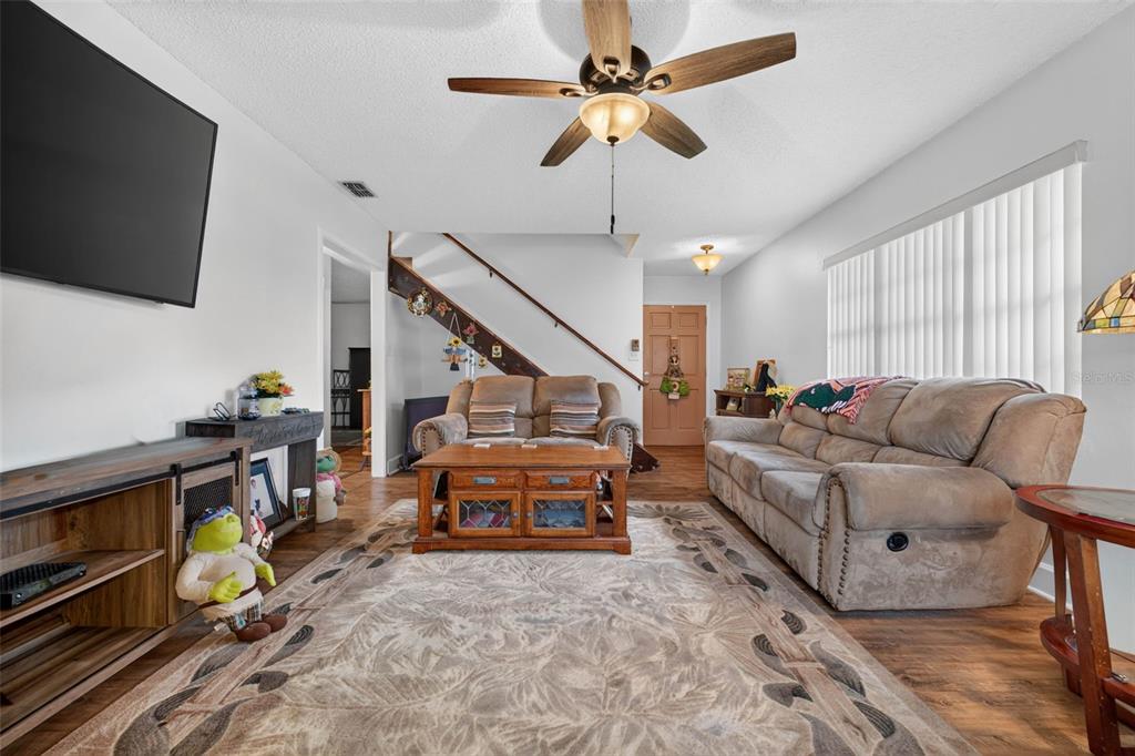 A brick house exterior features a front door with a decorative wreath and a porch — 5838 OLD BARTOW EAGLE LAKE ROAD, WINTER HAVEN, FL