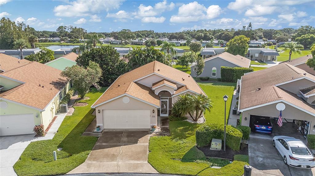 An aerial view of a suburban house with a tan exterior and brown roof — 3248 NOEMI DRIVE, NEW PORT RICHEY, FL