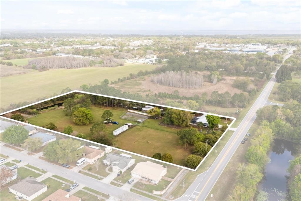 An aerial view shows a large, rectangular residential lot with trees and structures — 2270 OLD HICKORY TREE ROAD, ST CLOUD, FL