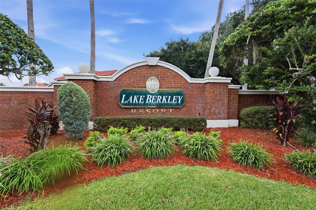 A brick entrance sign for Lake Berkley Resort sits behind a landscaped garden bed — 4613 FORMBY COURT, KISSIMMEE, FL