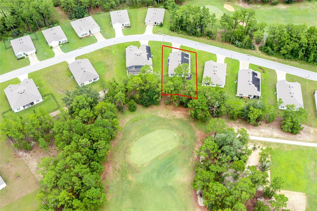 An aerial view shows a residential house with a red outline bordering a golf course — 216 HICKORY COURSE, OCALA, FL