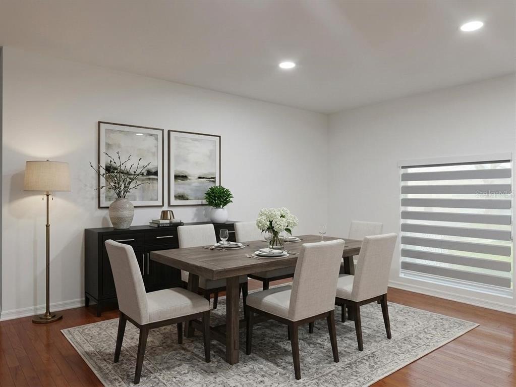 A dining room features a wooden table, six upholstered chairs, a sideboard, and a patterned rug — 10245 DEVONSHIRE LAKE DRIVE, TAMPA, FL