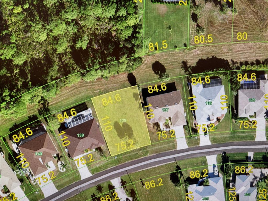 This aerial map shows a residential neighborhood with highlighted vacant lots and existing houses — 129 WHITE MARSH LANE, ROTONDA WEST, FL