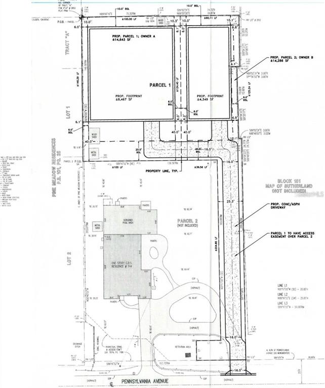 A large, flat, grassy residential lot is bordered by trees and a wooden fence — 0 PENNSYLVANIA AVENUE, PALM HARBOR, FL