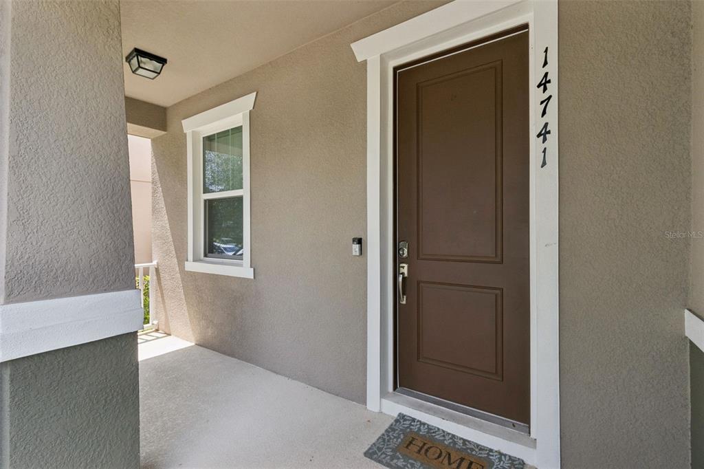 A spacious bedroom features a platform bed, two dressers, a ceiling fan, and a walk-in closet — 14741 SNOWY EGRET STREET, WINTER GARDEN, FL