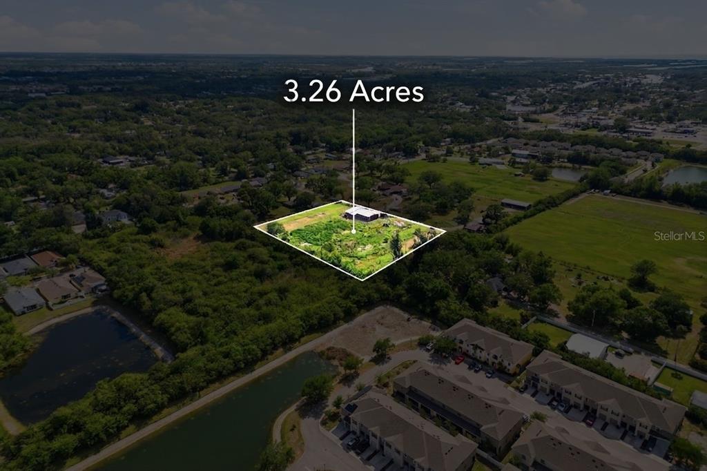 An aerial view shows a rectangular plot of land highlighted as 3.26 acres — SHELL POINT ROAD, RUSKIN, FL