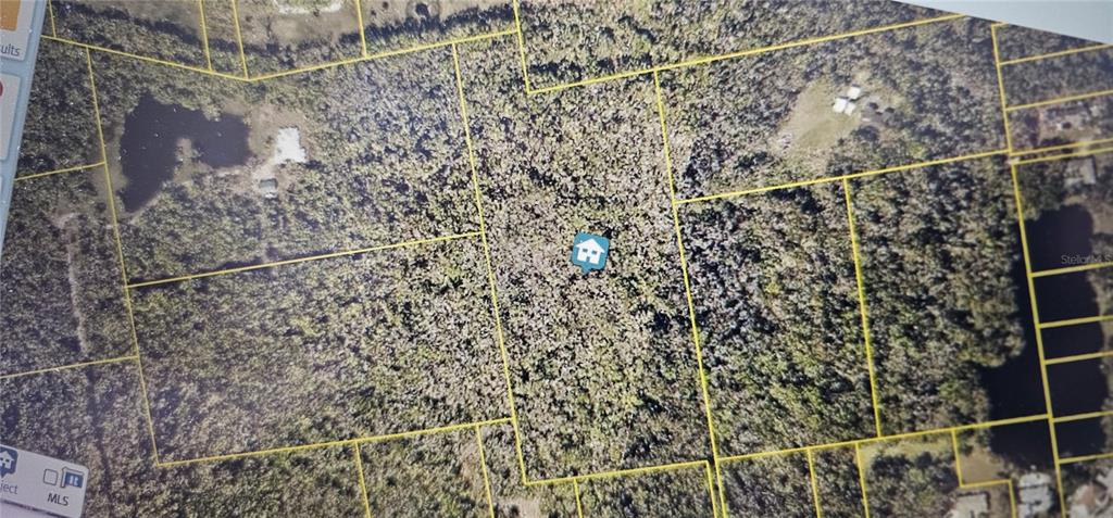 This is an aerial map view showing a plot of land outlined in yellow — W INDIAN RIVER BOULEVARD, EDGEWATER, FL