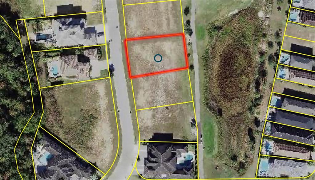 An aerial view shows several residential lots and houses bordering a golf course — 1161 GRAND TRAVERSE PARKWAY, REUNION, FL
