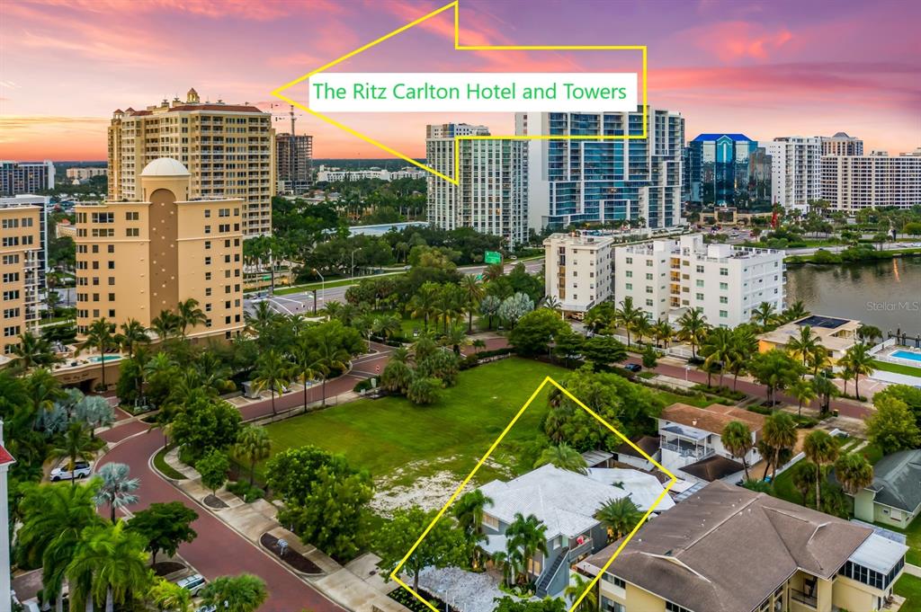 An aerial view shows a residential neighborhood with a house highlighted in the foreground — 161 GOLDEN GATE POINT, SARASOTA, FL