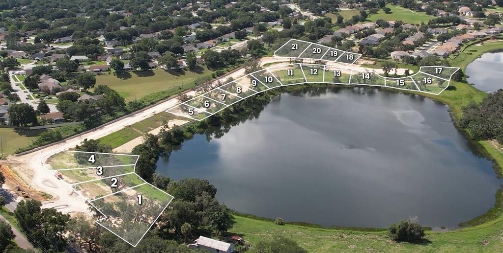 An aerial view shows a map of numbered residential building lots bordering a lake — 161 TRANQUIL MIRROR LAKE COURT Lot 9, CLERMONT, FL