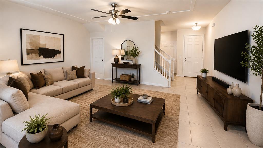 A living room features a beige sectional sofa, a wooden coffee table, and a television — 4420 GUMBO LIMBO DRIVE, ORLANDO, FL