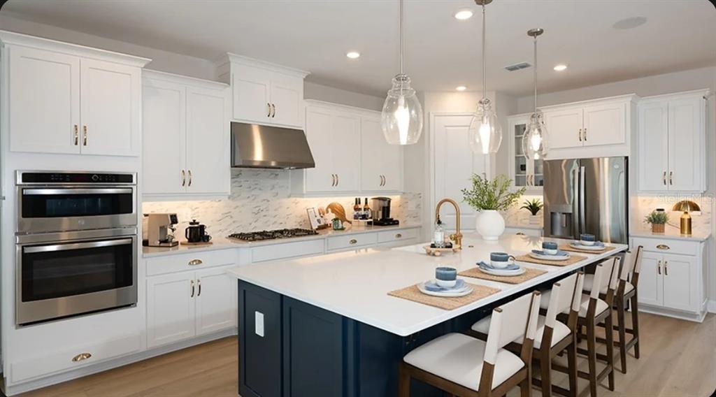 This floor plan shows a single-story home layout featuring a garage, kitchen, great room, and primary suite — 12859 TREELINE RIDGE AVENUE, SAN ANTONIO, FL