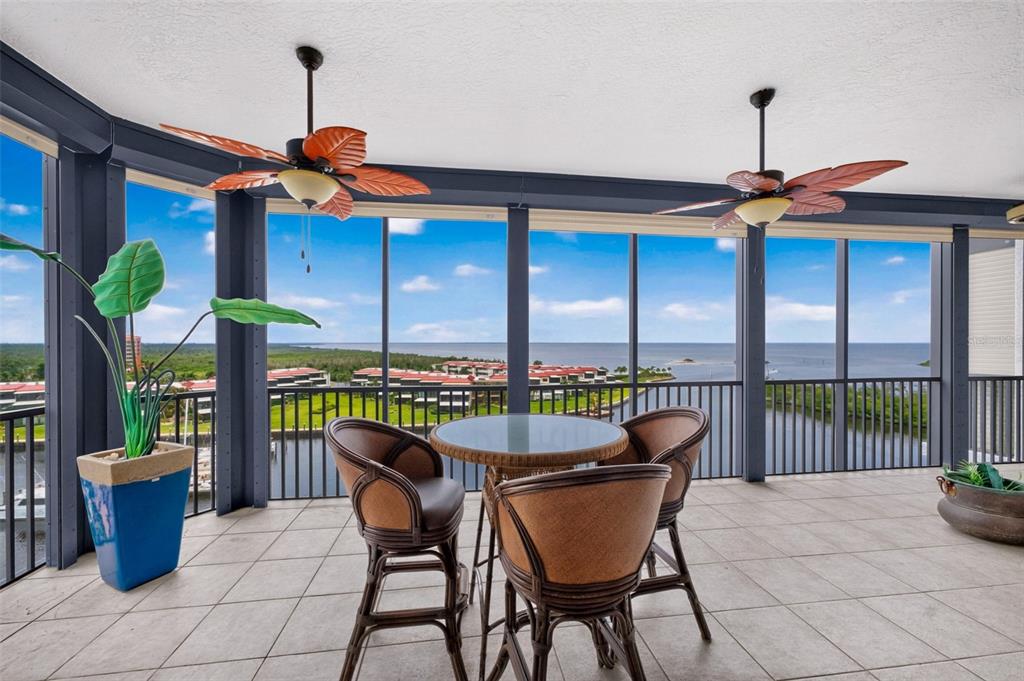 An aerial view of two waterfront apartment buildings with a pool and a boat dock — 3313 SUNSET KEY CIR UNIT 701, PUNTA GORDA, FL
