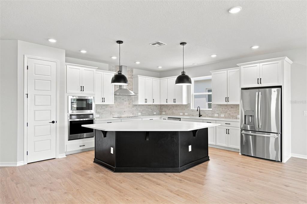 This is a floor plan for a single-story home with three bedrooms, a study, and garage — 5117 CHATTAHOOCHEE BEND, ST CLOUD, FL