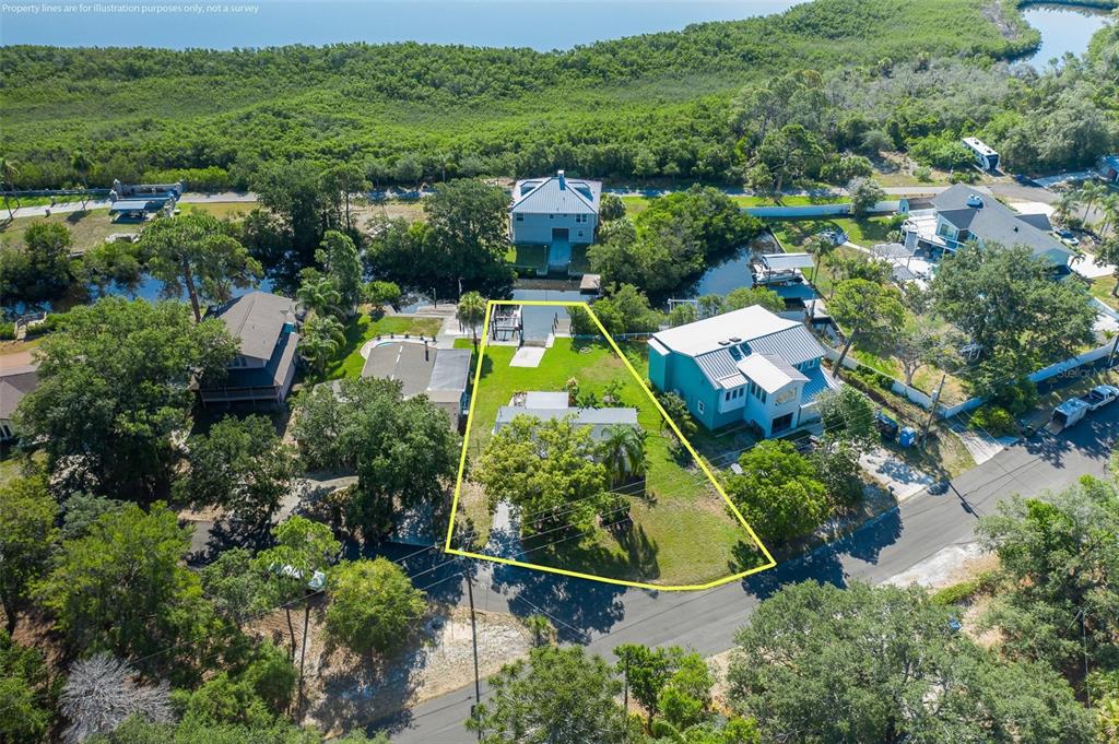 An aerial view shows a residential lot with a house, lawn, and private boat dock — 3318 PINEVIEW DRIVE, HOLIDAY, FL