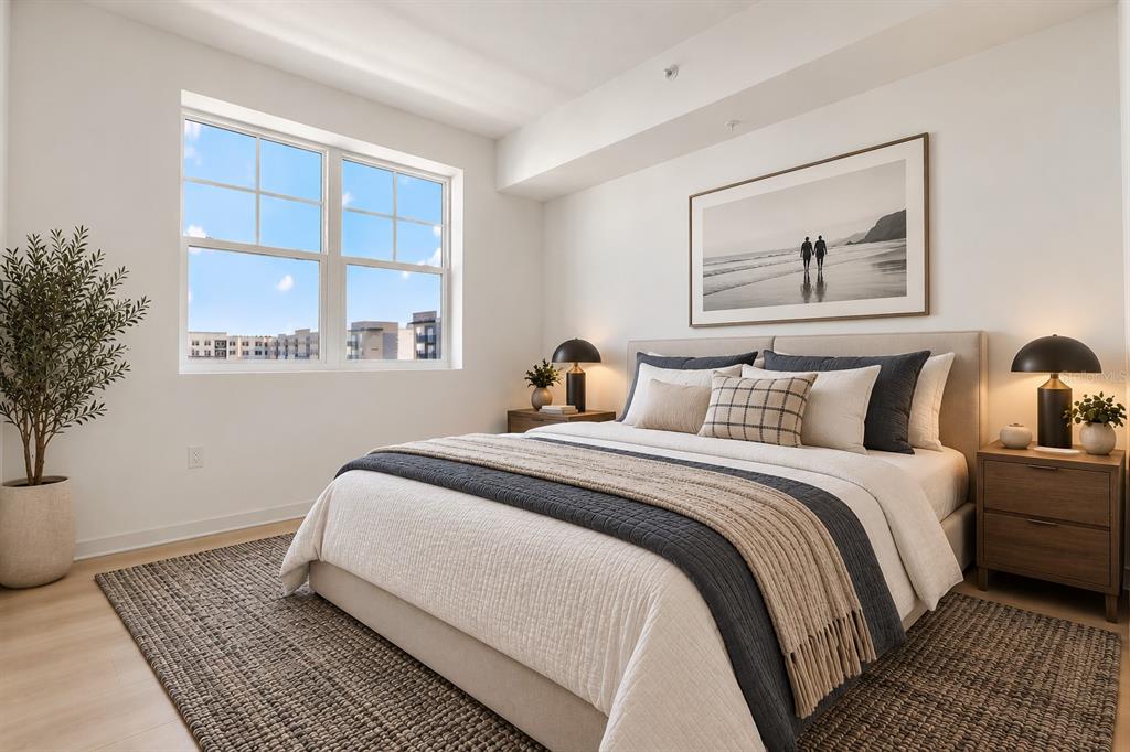 A bedroom features a twin bed, a wooden desk, a floating shelf, and a horizontal window — 5563 MILLENIA PARK BOULEVARD UNIT 401, ORLANDO, FL