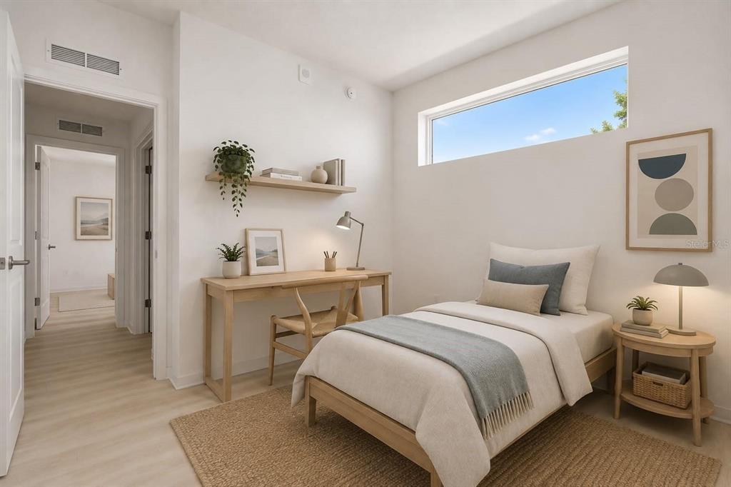 A bedroom features a twin bed, a wooden desk, a floating shelf, and a horizontal window — 5563 MILLENIA PARK BOULEVARD UNIT 401, ORLANDO, FL