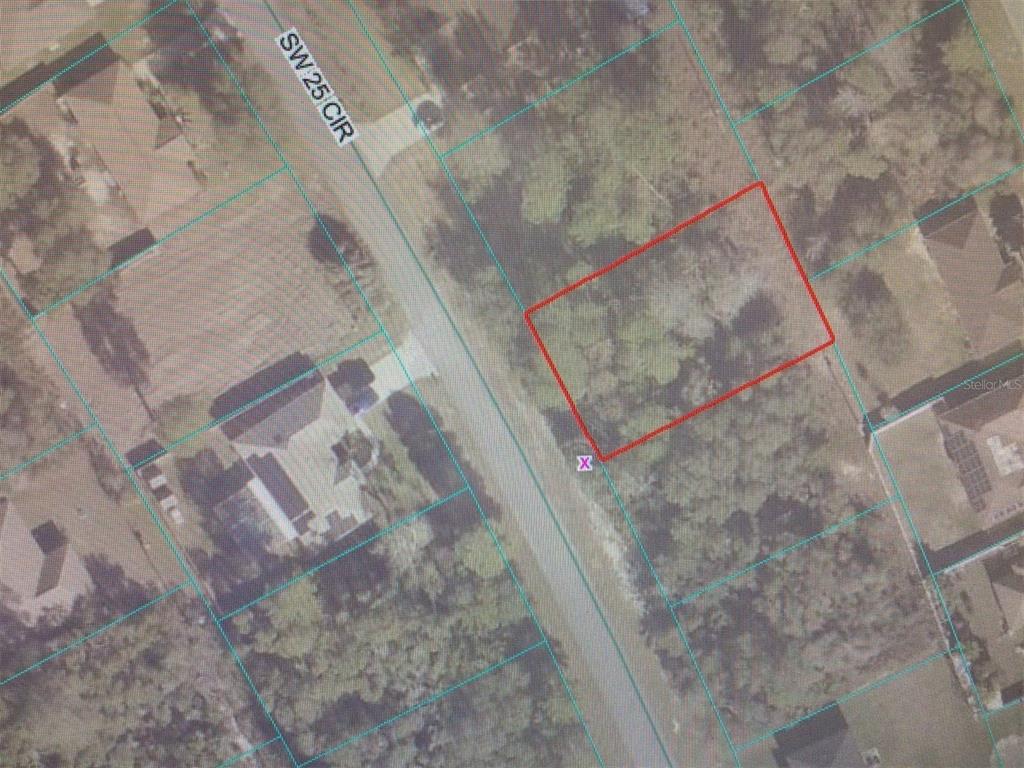 This is an aerial map showing a vacant, wooded lot outlined in red — 0 SW 25 CIRCLE, OCALA, FL